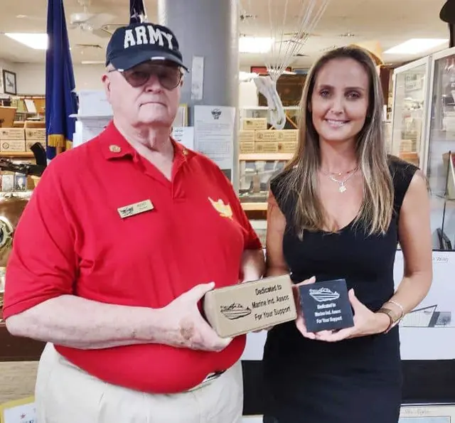 Kent Weston presenting Memorial Paver to Tiffany Schank, Executive Director of Marine Industries Association of Collier County