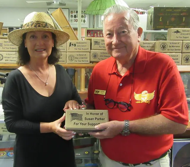 John Green presenting Memorial Paver to supporter, Susan Paker