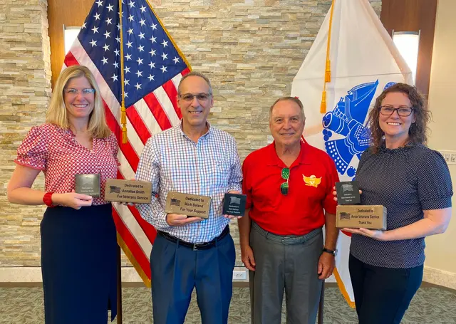 Dave Hinds, (president in red shirt), presenting Pavers to Avow Hospice Directors