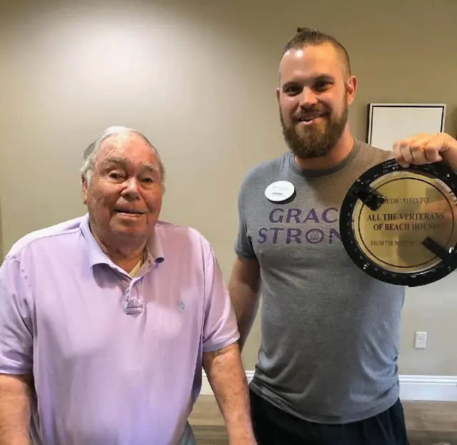 Bearing Circle presentation to Navy veteran Paul and the Activity Director of the Beach House, John Ferris