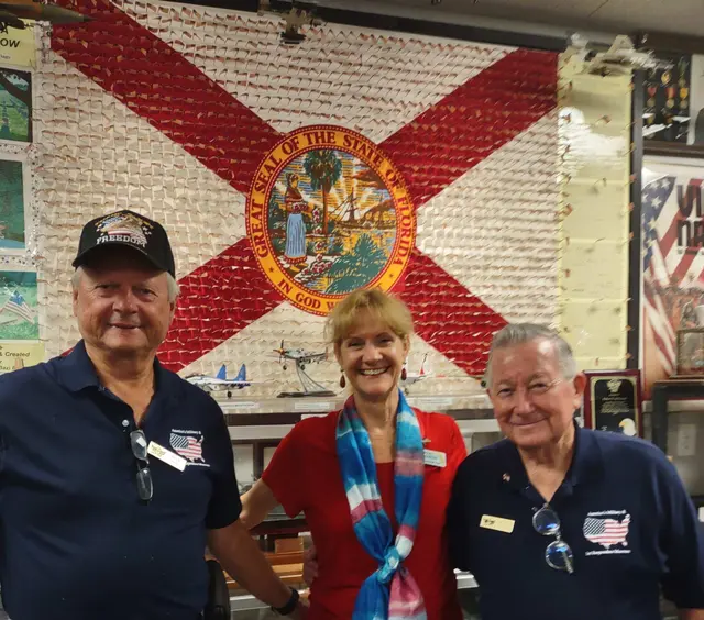Daughters of the American Revolution group tour. DAR Secretary Becky Schlueter with docents Roy Linderman (left) and John Green