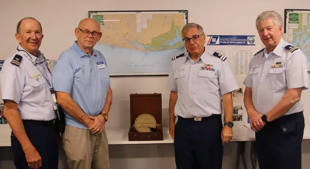 Docent Richard Heinrich presented 1940’s brand new Bearing Circle in an original box to officers of the Marco Island Coast Guard Auxillary