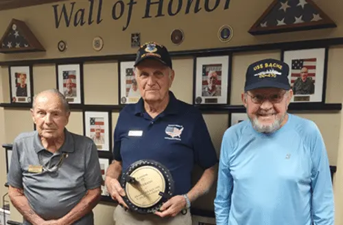 George Gully, museum docent, presenting for the Wall of Honor at Bradford Square Retirement Community to Adolph (L) and Richard (R), residents