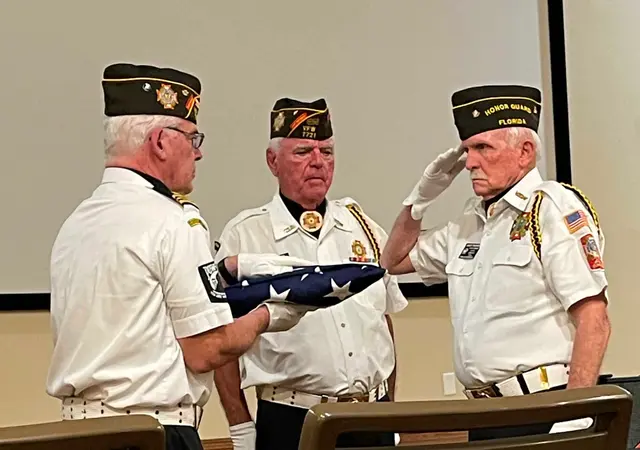 VFW Post 7721 Honor Guard flag folding detail during Memorial Day Program