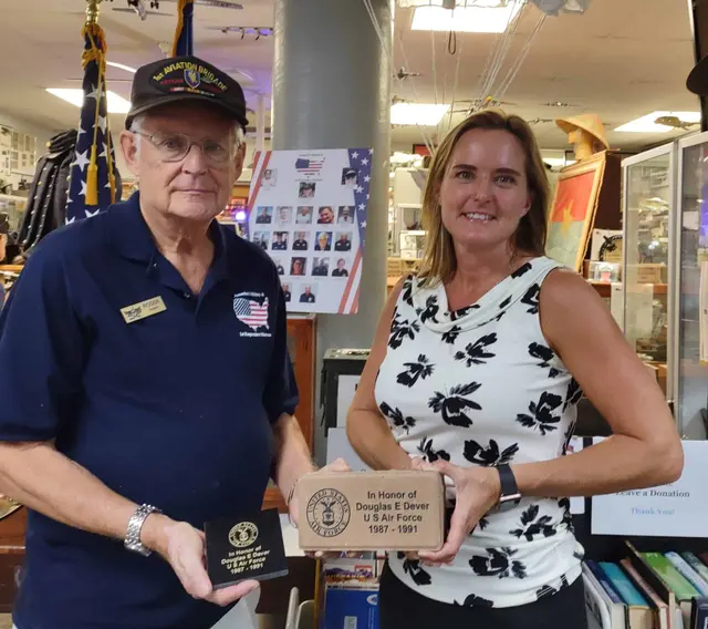 Roger Crick, Docent presenting paver for Doug Dever to Erin Dever