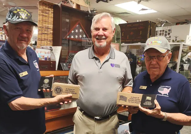 Presentation to Collier County Wounded Warriors and their president. Left to right: Lynn Cooper, docent, Dale Mullens, president of CCWW, John Watson, docent