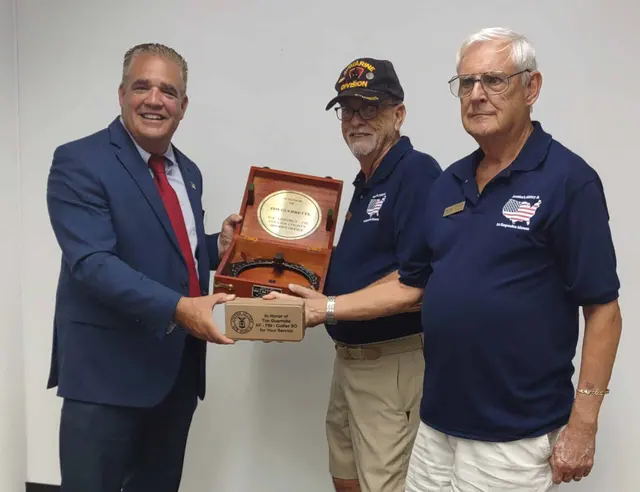 New BOD, Tim Guerrette, accepting award from docents, Bob and Roger