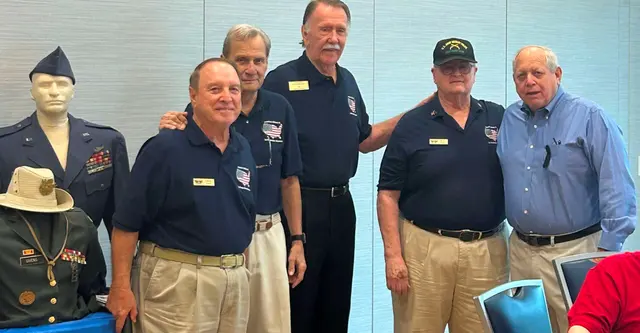 Alen Silver (light blue shirt) was honored by members of the Military Museumfor Veteran’s Supporter of the Year 2023