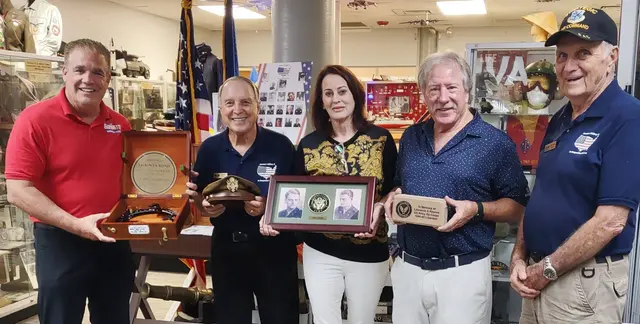 Gifts presented to Laura and Jim Dixon by L to R Board member Tim Guerrette, Dave Hinds and docent, George Gully