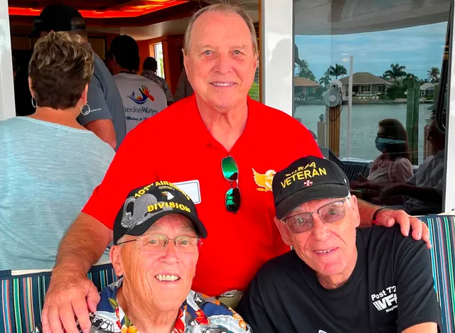 Dave Hinds (in red) honoring: Left: past president of Museum, Dodge McDonald and charter member, Joel Banow