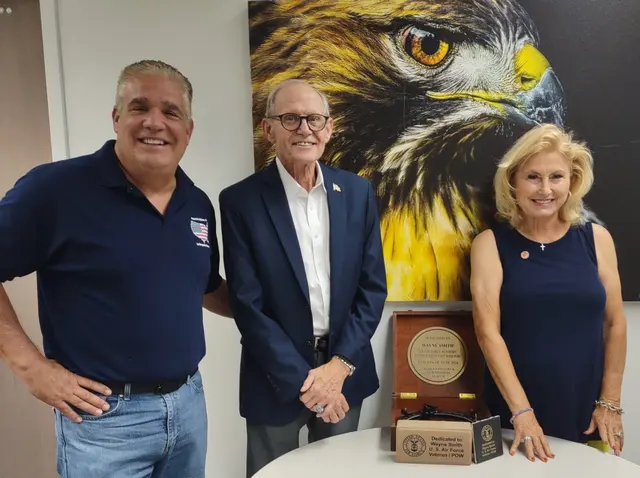 Veteran of the Year 2024 Wayne Smith (center) with his wife Lois Bolin and Board of Director Tim Guerrette